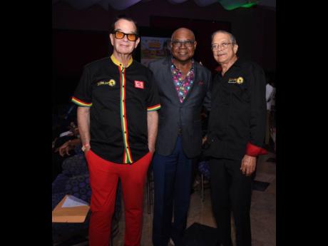 Smiling for the camera are (from left) Joe Bogdanovich, CEO of DownSound Entertainment; Minister of Tourism Edmund Bartlett; and Robert Russell, deputy chairman of Reggae Sumfest, at this year’s launch at Iberostar Resort in Montego Bay.
