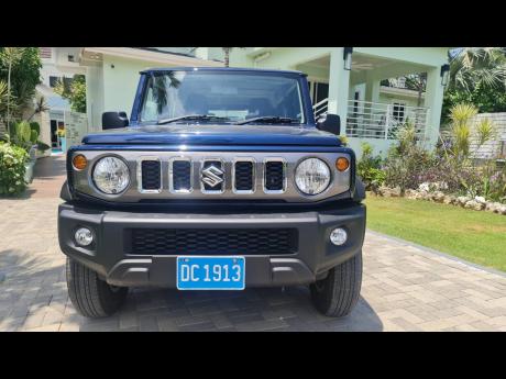 The new 5-door Suzuki Jimny retains the classic bold grille with a hint of chrome, ready for adventure.