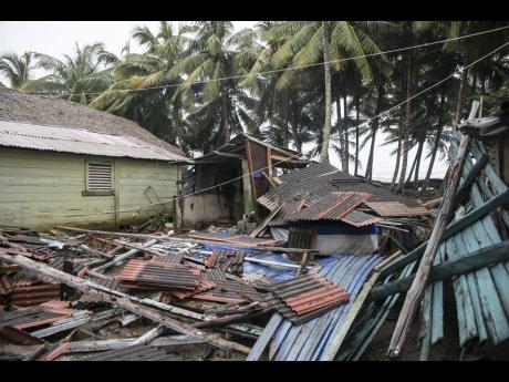 A home flattened by Hurricane Irma lies in a pile in Nagua, Dominican Republic, on September 7, 2017. 