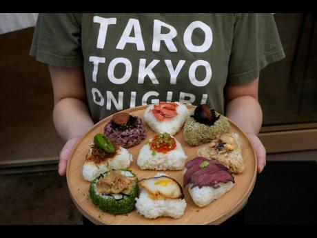 A variety of onigiri, rice balls, are seen on a plate at a Taro Tokyo Onigiri shop.