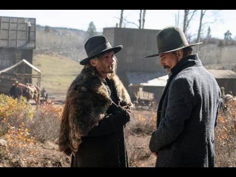 This image released by Warner Bros. Pictures shows Jamie Campbell Bower, left, and Kevin Costner in a scene from ‘Horizon: An American Saga-Chapter I’.
