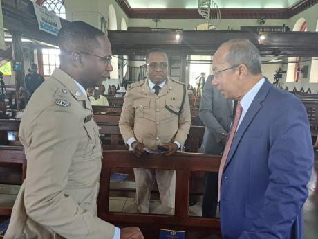 Minister of National Security Dr Horace Chang (right) speaks with Senior Superintendent of Police Eron Samuels (left), the commanding officer for the St James Police Division, and Deputy Superintendent of Police Peter Salkey, of the Hanover Police Division