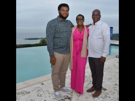 Sasha Spence, Private Client Account Executive, National Commercial Bank Private Banking, is sandwiched between Krystof and his father Horace Gyles, owner of HBG Associates Chartered Accountants (right) at the Father's Day Cocktail event at Reading Heights