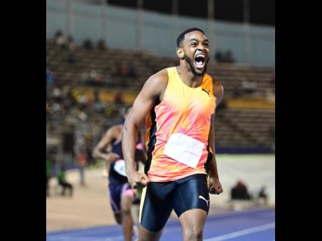 Deandre Watkin of elite performance celebrates winning the men’s 400 metres.
