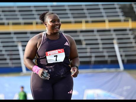 Danniel Thomas-Dodd is all smiles after a throw that won her the national title at the JAAA/PUMA National Championships inside the National Stadium on Saturday.