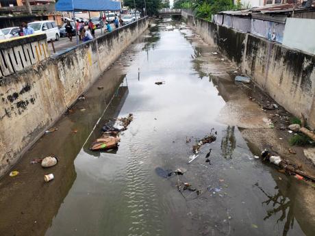 Debris in a section of Montego Bay’s North Gully on Monday. The National Works Agency is cleaning the waterway, which has experienced overflowing during past instances of heavy rain, leading to flooding in sections of downtown Montego Bay.