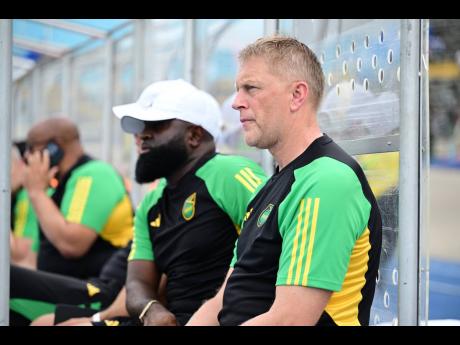 Former Reggae Boyz head coach Heimir Hallgrimsson (right) and his assistant, Merron Gordon, look on during a Concacaf World Cup qualifier against the Dominican Republic inside the National Stadium on June 6.