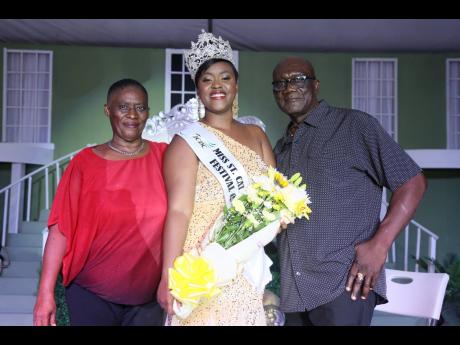 Euleta Slowden (left) and Everton Grant proudly pose with daughter Shahida Grant, Miss St Catherine Festival Queen 2024.