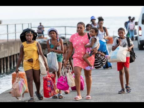 Evacuees from Union Island arrive in Kingstown, St. Vincent and the Grenadines on Tuesday. The island, in the Grenadines archipelago, was hit by Hurricane Beryl. 