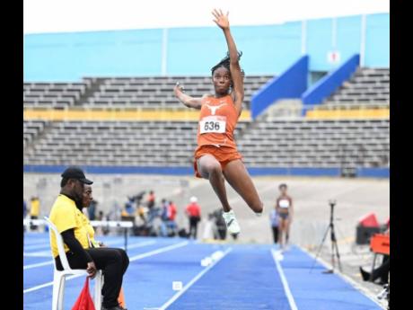 Ackelia Smith competing in the women’s long jump on the opening day of the JAAA/PUMA National Junior and Senior Championships at the National Stadium. 	