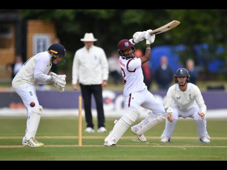 West Indies batsman Javem Hodge drives through off side during a cricket game against an FCC Select.