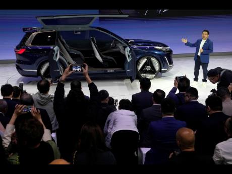 
Jerry Gan, CEO of Geely Auto Group, unveils the Galaxy Starship, a new technology flagship AI-driven SUV prototype during Auto China 2024 in Beijing, on April 25, 2024.
