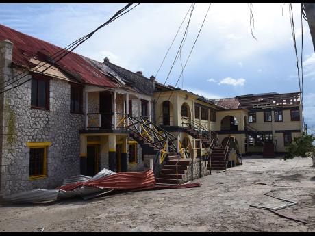 Hurricane-battered buildings at Munro College in Potsdam, St Elizabeth. Thirty-one of the secondary school’s 35 buildings were damaged by Hurricane Beryl last week.