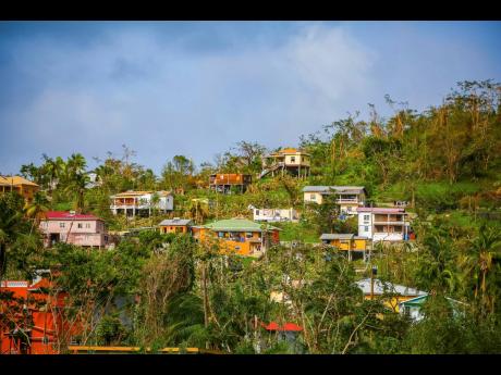 Roofs of houses lie damaged by Hurricane Beryl in St Patrick, Grenada, Tuesday, July 2.