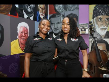 Antonette Newell (left), business strategist and consultant, and Tiffanie Thomas, communication consultant and museum curator, are all smiles.