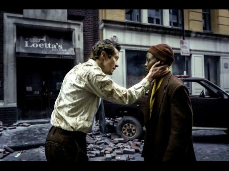 This image released by Paramount Pictures shows Joseph Quinn as Eric and Lupita Nyong’o as Sam in a scene from ‘A Quiet Place: Day One’.