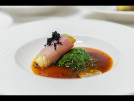 Couples Resorts Regional Asian Chef Anish Kumar’s smooth starter/amuse-bouche, hakusai togarashi spiced bluefin tuna, wakame seaweed wrap and ponzu dressing.