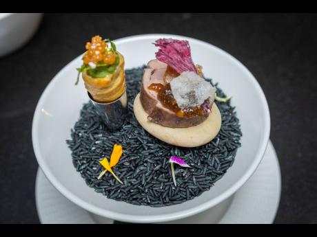 BELOW: Chef Volae Williams, executive chef, ROK Hotel Kingston, prepared a duck mousse mosaic and callaloo cornet pie with spicy duck mousse and ginger rice paper.