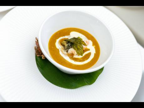 Jarrahdale roasted pumpkin and green asparagus bisque with pickled whelks, lime and coconut foam prepared by Couples Tower Isle Executive Chef Valentine McKenzie.