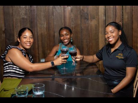 From left: Katherine Peralto, Dana Theoc and Amanda Hutton, co-owner, Ahmeraki Cafe, share a cheerful moment at Monday’s launch.