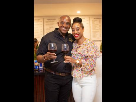 Heston Hutton (left), chief executive officer, Ahmeraki Cafe, and Jhannel Townsend, sales executive, Harbour Wines, share a moment.