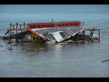 The Poko Loko floating bar, which was based at Mahogany Beach, Ocho Rios, ended up at Little Dunn’s River after the hurricane, damaged but still floating.