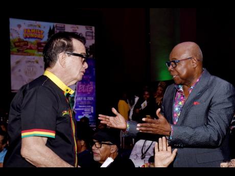 Edmund Bartlett (right), minister of tourism, speaking with Joe Bogdanovic, CEO of DownSound Entertainment (left), during the launch of Reggae Sumfest at Iberostar Hotel in Montego Bay, St James.