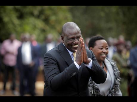 Kenya’s President William Ruto walks with his wife Rachel Ruto as he prepares to address the media at his official residence in Nairobi, Kenya on September 5, 2022. 