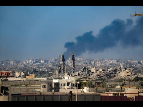 Smoke rises following an Israeli airstrike in the central Gaza Strip on Wednesday.