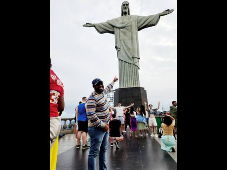 McKay points at the iconic Christ the Redeemer statue.