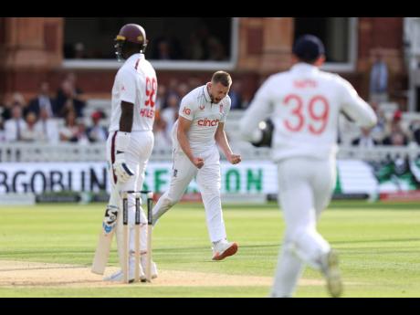 England’s Gus Atkinson (centre) celebrates taking the wicket of West Indies’ Jason Holder on day two of the first Test match at Lord’s Cricket Ground, London, yesterday.