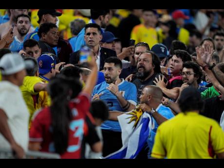 Fans argue after a Copa America semi-final football match between Uruguay and Colombia in Charlotte, North Carolina, on Wednesday.