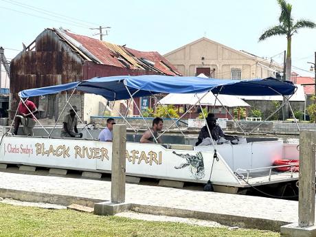 Tourists being taken on a tour of the Black River Safari in Black River, St Elizabeth on Wednesday, July 10.