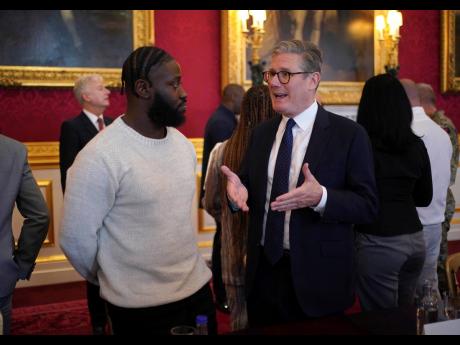 Prime Minister Sir Keir Starmer (right) speaking to Gideon Buabeng at an event for The King’s Trust to discuss youth opportunity, at St James’s Palace in central London, Friday July 12.