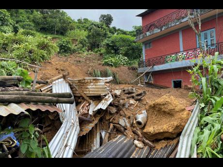 Damaged houses knocked by landslides are seen on the outskirts Pokhara, Nepal yesterday.