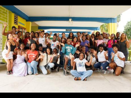 Participants, trainers, and sponsors of the inaugural SCATE Girls in Tech Camp 2024 gather for a quick photo at the University of the West Indies, Mona Computer Science building. The camp empowered girls to bring their imaginations to life while developing