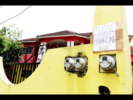 Phone charging sign at Cecil Coleman’s home in Aleppo, St Mary.