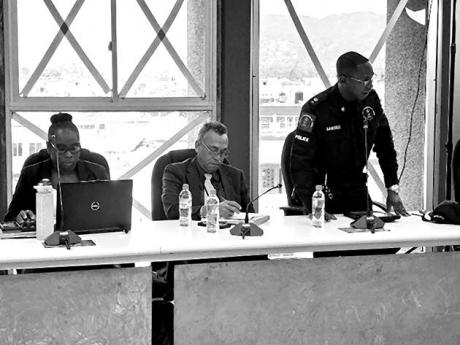 Senior Superintendent of Police Eron Samuels (right), commanding officer for the St James police division, addressing the monthly meeting of the St James Municipal Corporation on Thursday, July 11, 2024. Also pictured, from left: Dr Tanique Bailey-Small, S