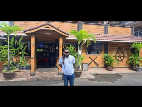 Businessman Telief ‘Peter’ Hall posing in front of his business establishment, Roots 21, at West Palm Avenue in Port Antonio, Portland.