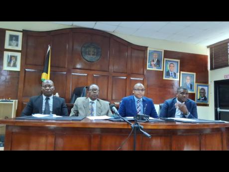 From left: Staphel Thomas; acting parish disaster coordinator; May Pen Mayor Joel Williams; Rowhan Blake, CEO of the Clarendon Municipal Corporation; and Clevon Watson, acting chief engineering officer, addressing journalists within the council chamber at 