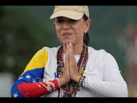 Opposition leader Maria Corina Machado greets supporters at a campaign rally for presidential candidate Edmundo Gonzalez, in Valencia, Venezuela, on Saturday.