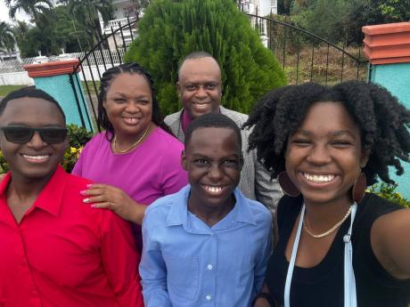 Jomar Clue (front centre) with his family members (from left, clockwise) his brother, Jovan; mother, Alethea; father, George; and sister, Tianna.