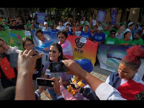 Abortion activists protest the proposal of a law, under debate by lawmakers, that would keep a total abortion ban in place in Santo Domingo, Dominican Republic, on Wednesday.