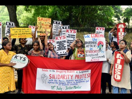 Activists of All India Democratic Students’ Organisation shout slogans in solidarity with protesting students in Bangladesh, at a protest gathering in New Delhi, India yesterday.