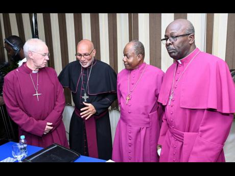 Archbishop of Canterbury Rev Justin Welby (left) chats with (from second left) Rev Howard Gregory, Archbishop of the West Indies and Bishop of Jamaica and The Cayman Islands; Rev Garth Minott, Suffragan Bishop of Kingston & Chair of the 200th Anniversary P