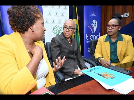 Fayval Williams (centre), minister of education and youth, in a discussion with Dr Kasan Troupe (right), permanent secretary, Ministry of Education and Youth (MOEY), and Latoya Harris-Ghartey, executive director, National Education Trust. Occasion was the 