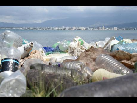 
In this April photo, plastic bottles are seen strewn on the shore along Port Royal main road.