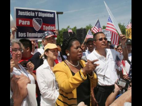 Sheila Jackson Lee (centre) speaks during an immigration rally in Guadalupe Plaza in Houston, Texas, April 10, 2006.