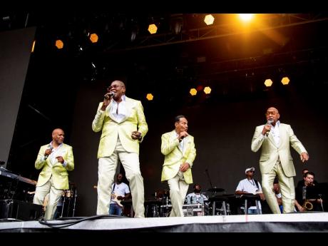 Roquel Payton, from left, Alexander Morris, Ronnie McNeir, and Duke Fakir of the Four Tops perform at the All In Music & Arts Festival in Indianapolis.