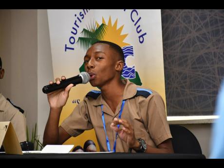 Taj Melbourne delivering his winning presentation on Tuesday at Beaches Ocho Rios.  